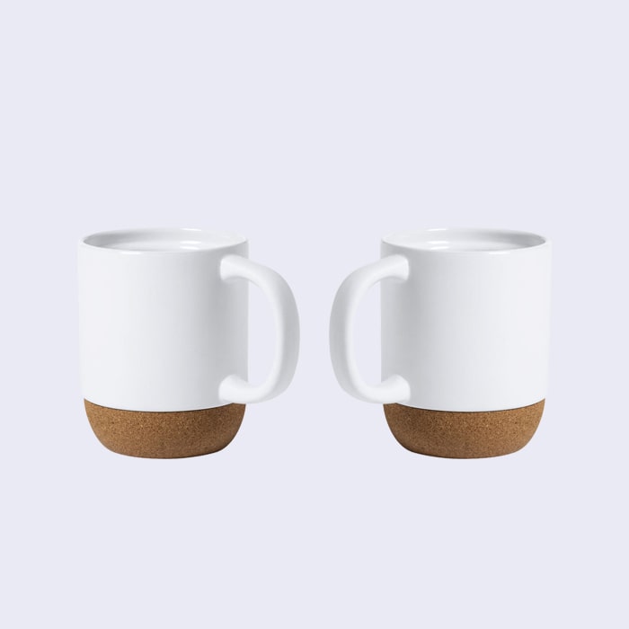 Άσπρη κούπα καφέ με βάση φελού με μπρος και πίσω ατάκα